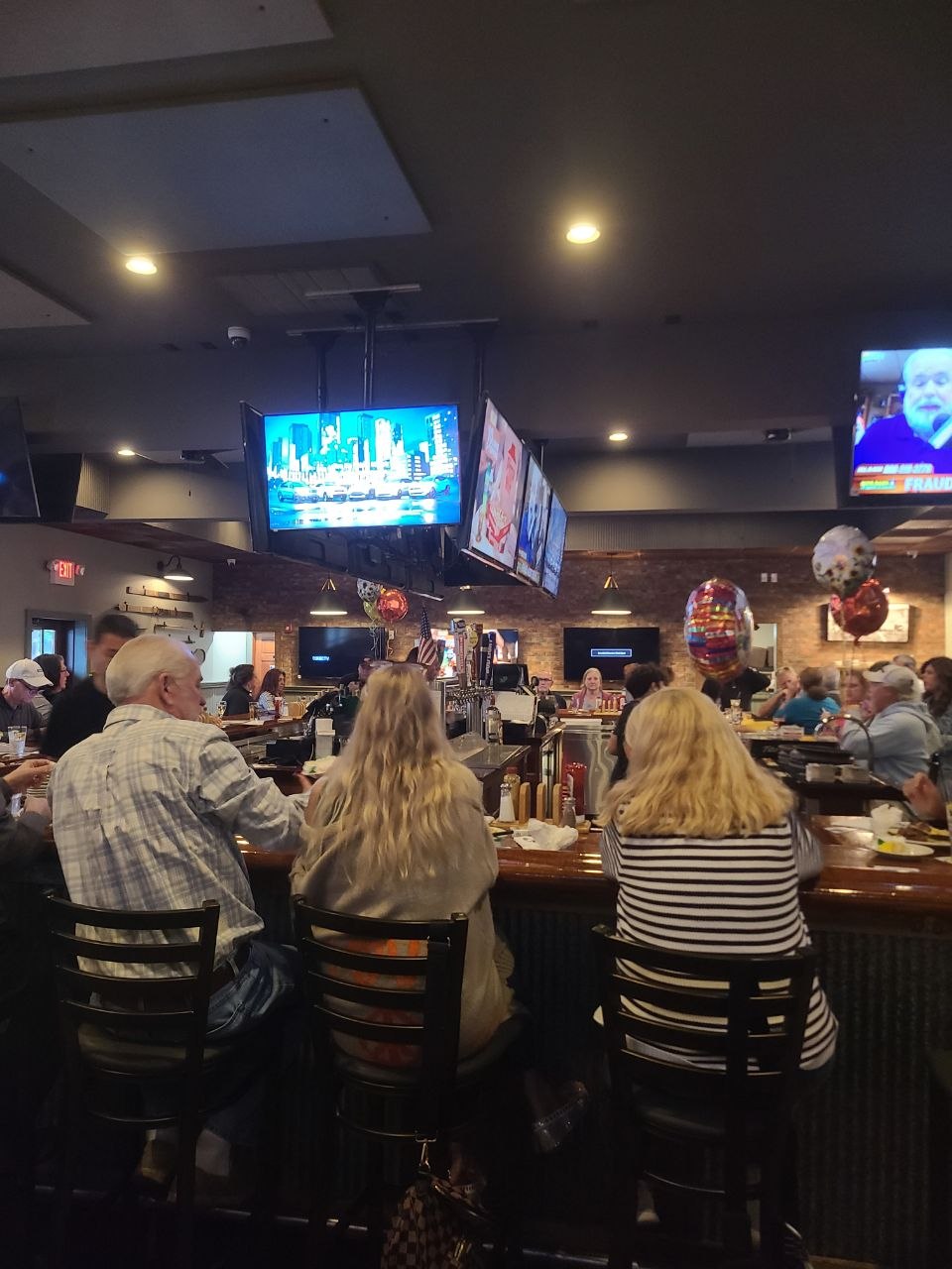 Guests at The Chapter House bar in Howell